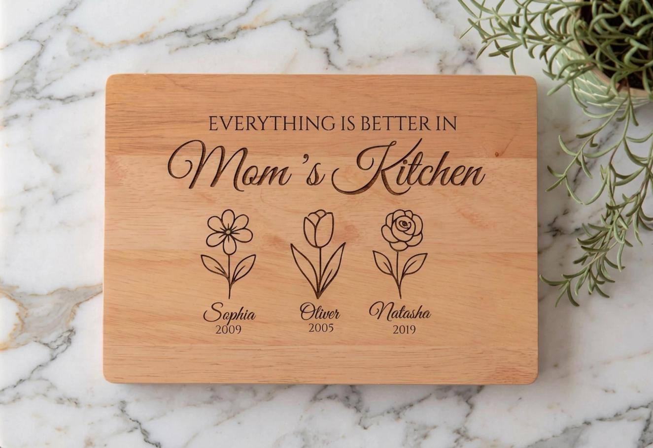 Personalized Mom’s Kitchen cutting board with engraved birth flowers names and years