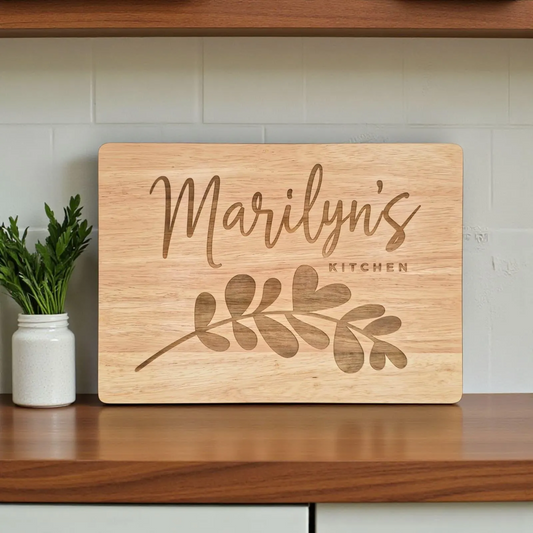 Personalized laser engraved wooden cutting board with custom family name for kitchen decor